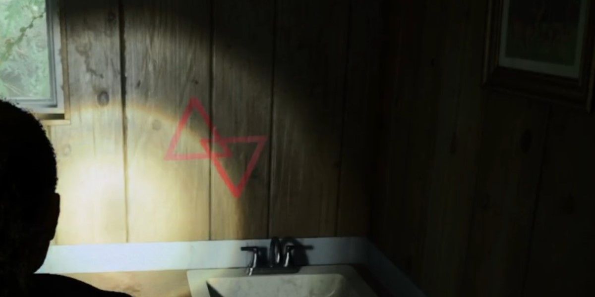 The Alan Wake 2 character found the first symbol above the bathroom sink that's needed to unlock the box outside.