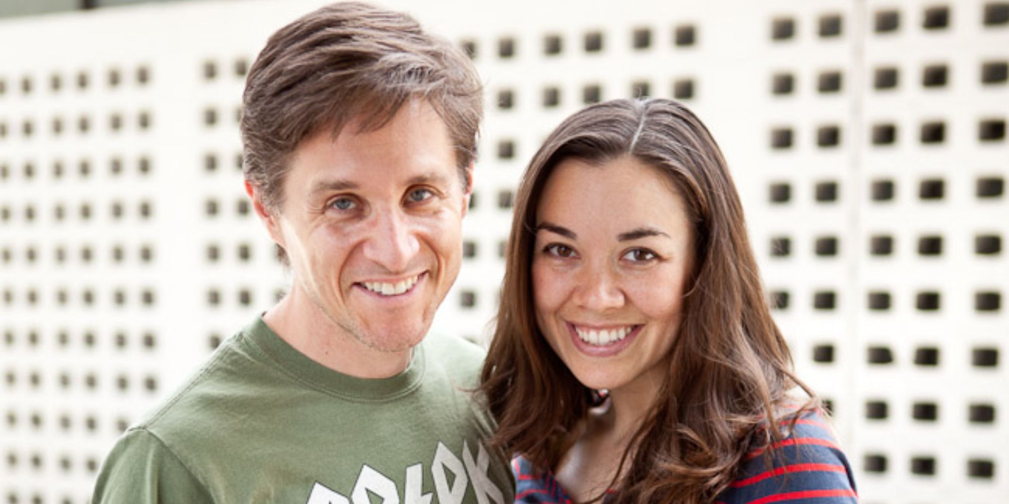 Still of Yuri Lowenthal wearing a green t-shirt and Tara Platt wearing a red, striped t-shirt 