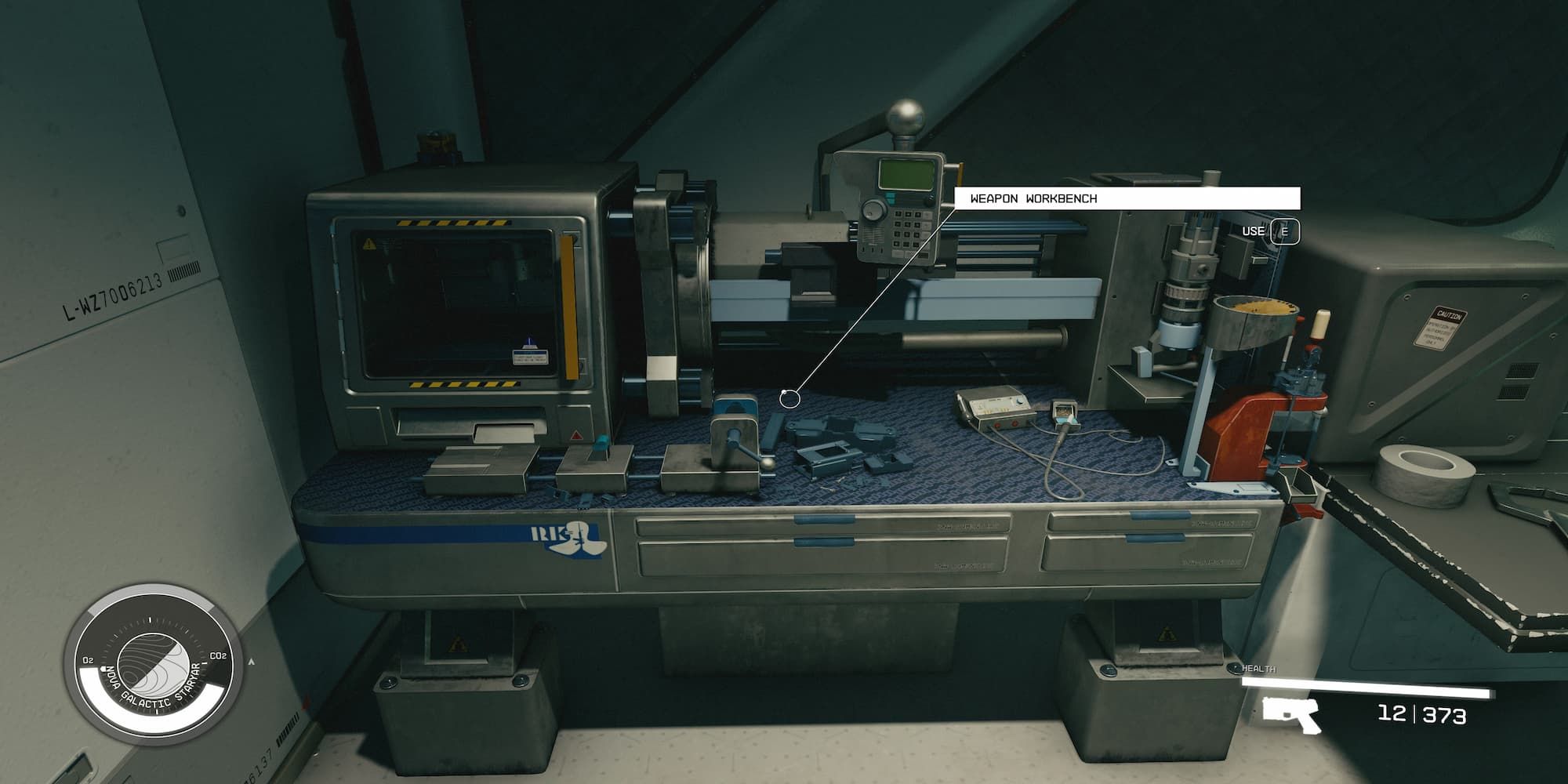 The Player Standing In Front Of A Weapon Workbench 