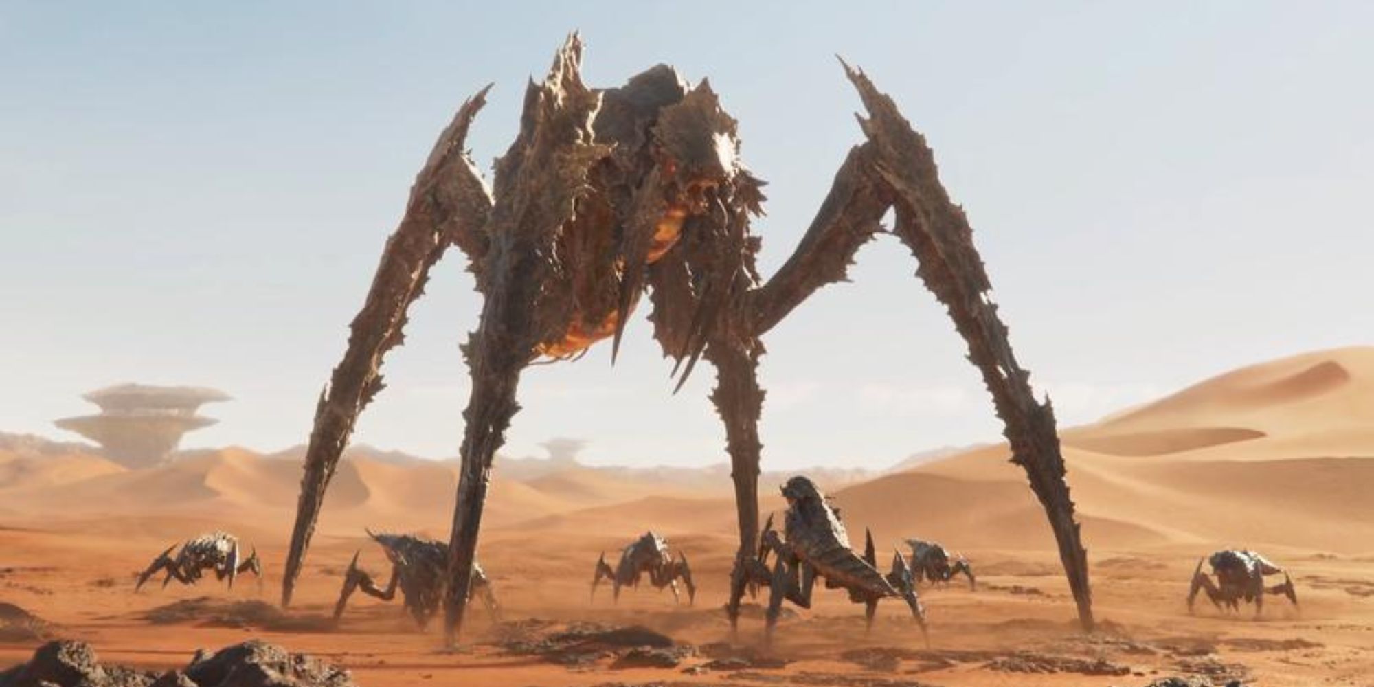 A Bile Titan surrounded by smaller Terminid on a desert planet