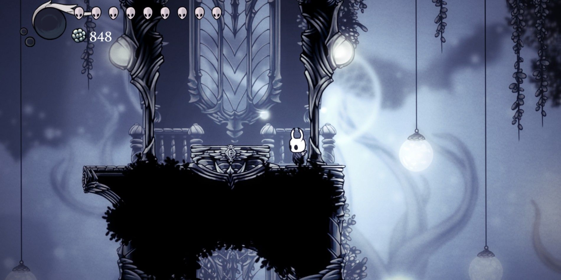 Hollow Knight standing by the first elevator in the White Palace