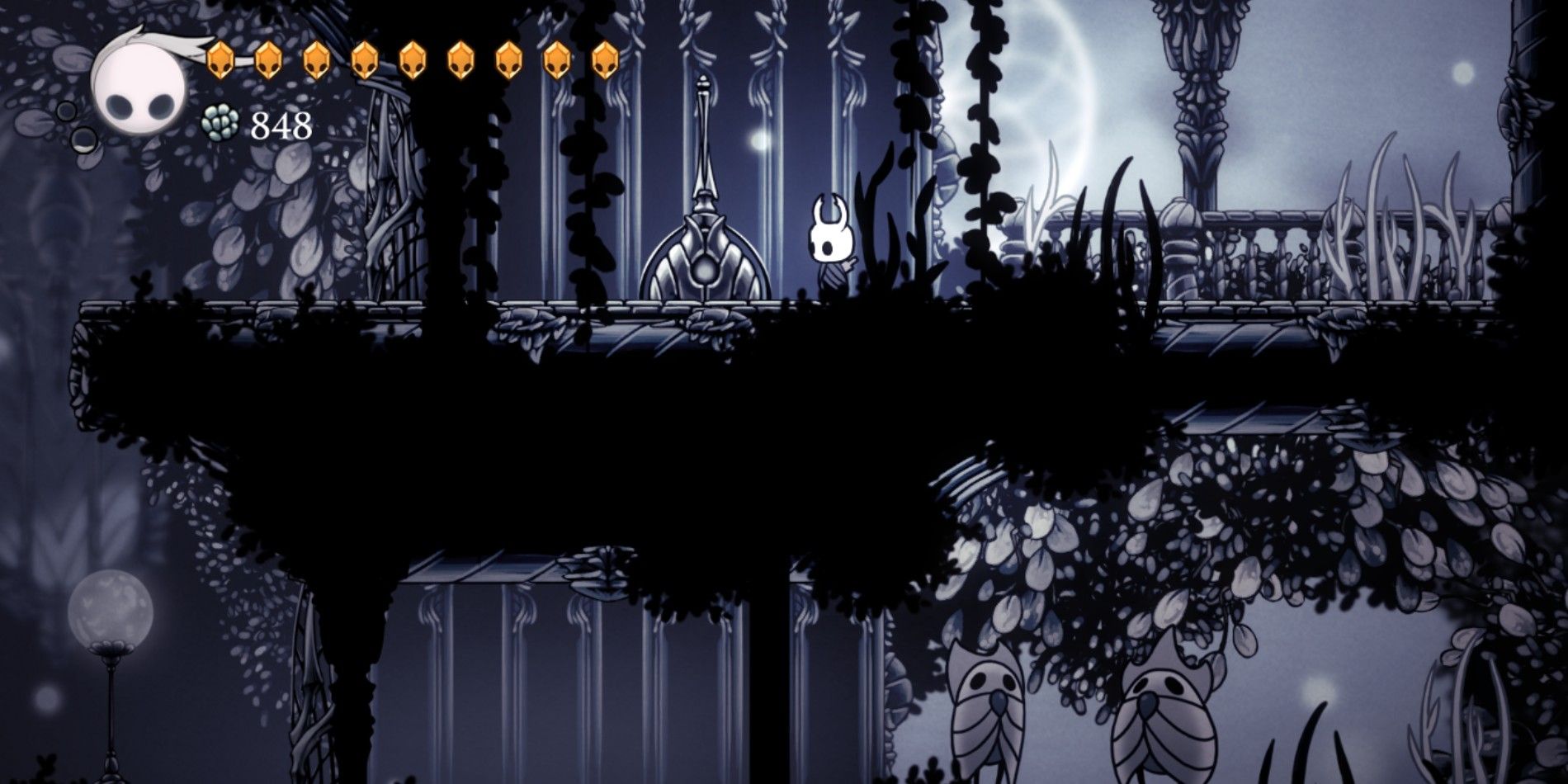 The Knight in Hollow Knight standing near a lever in the White Palace