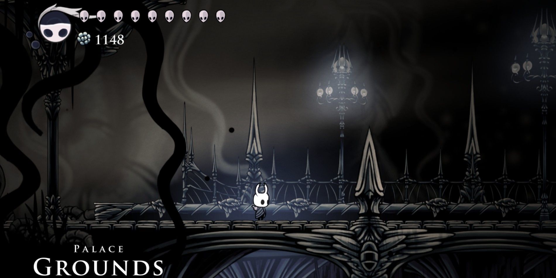 A picture of the Knight in Hollow Knight in the Palace Grounds