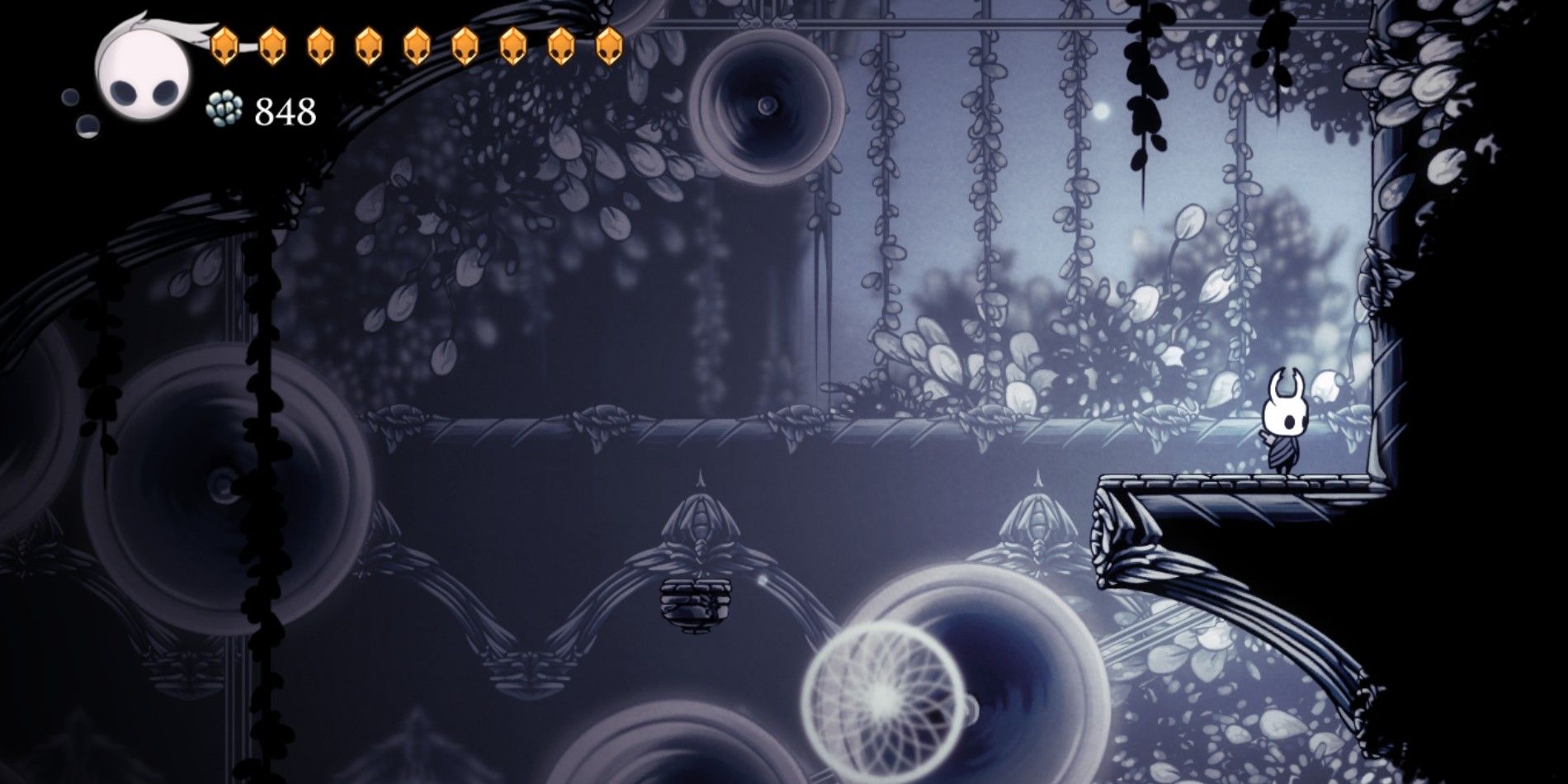 Knight in Hollow Knight standing on a platform in the White Palace