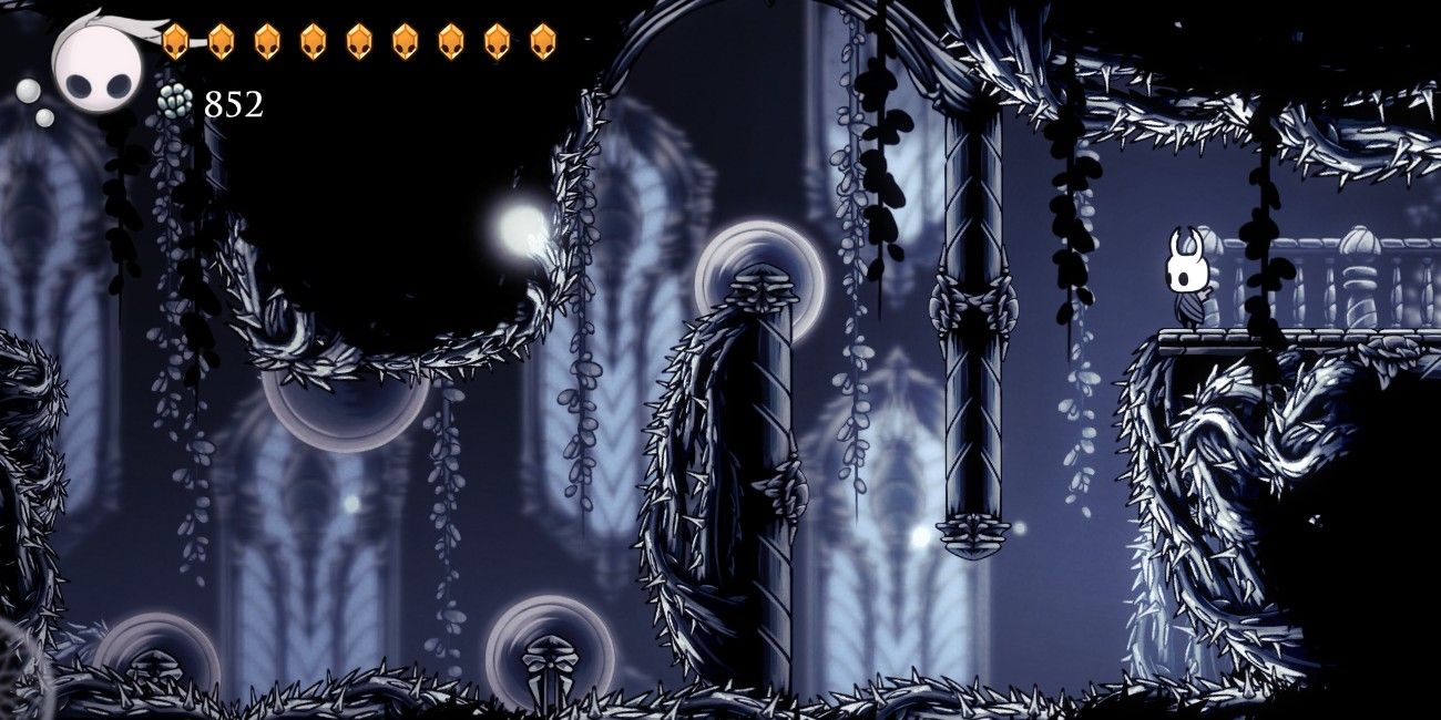 Looking into a room with saws in Path of Pain in Hollow Knight