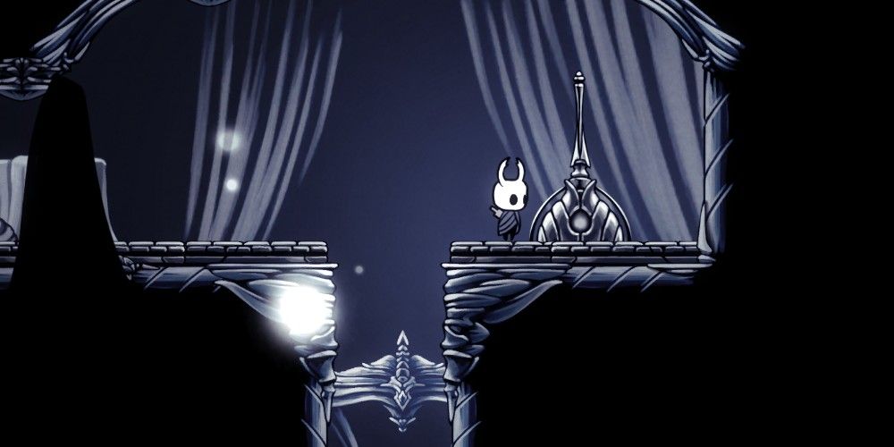 Knight in Hollow Knight standing by a lever in Path of Pain