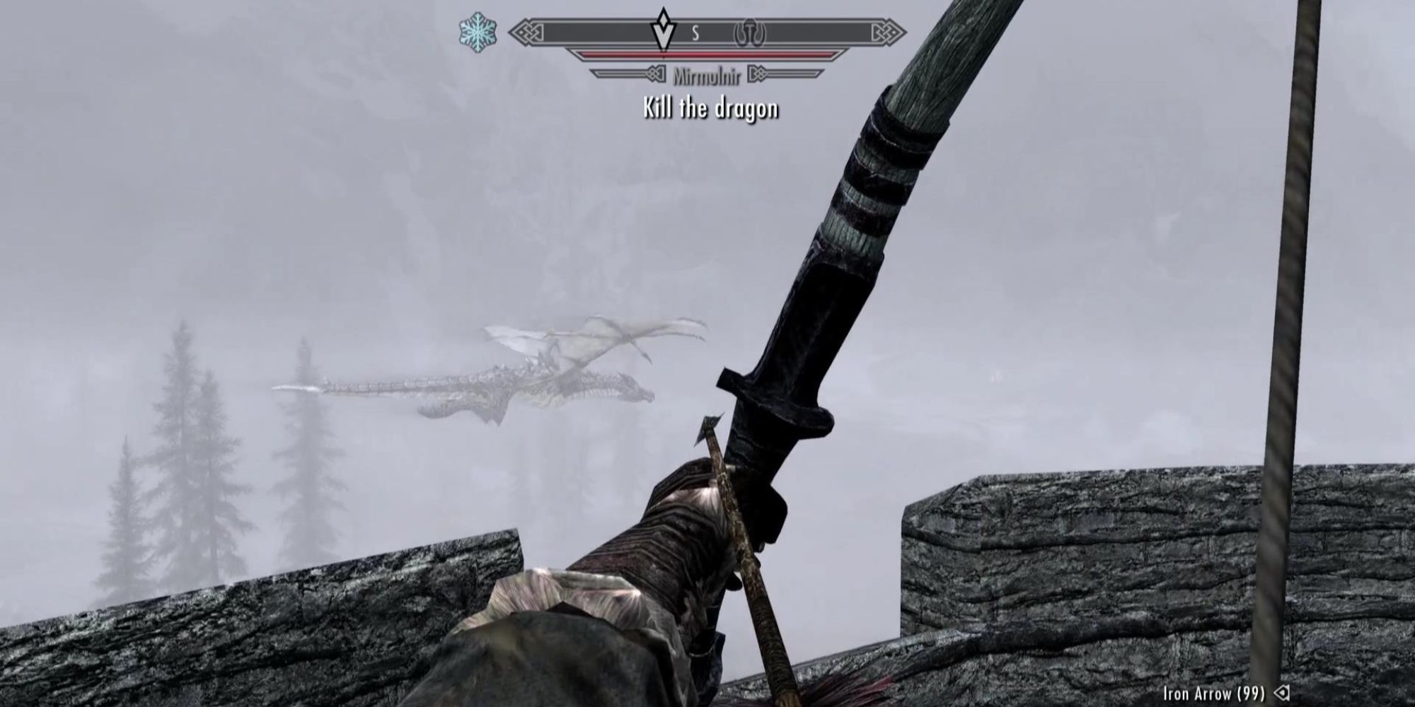 Mirmulnir flies circles around a watchtower in the fog in Skyrim.