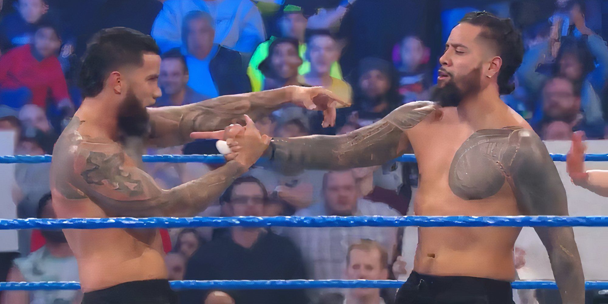 The Usos celebrate a victory over The Revival on the January 17, 2020 episode of WWE SmackDown.