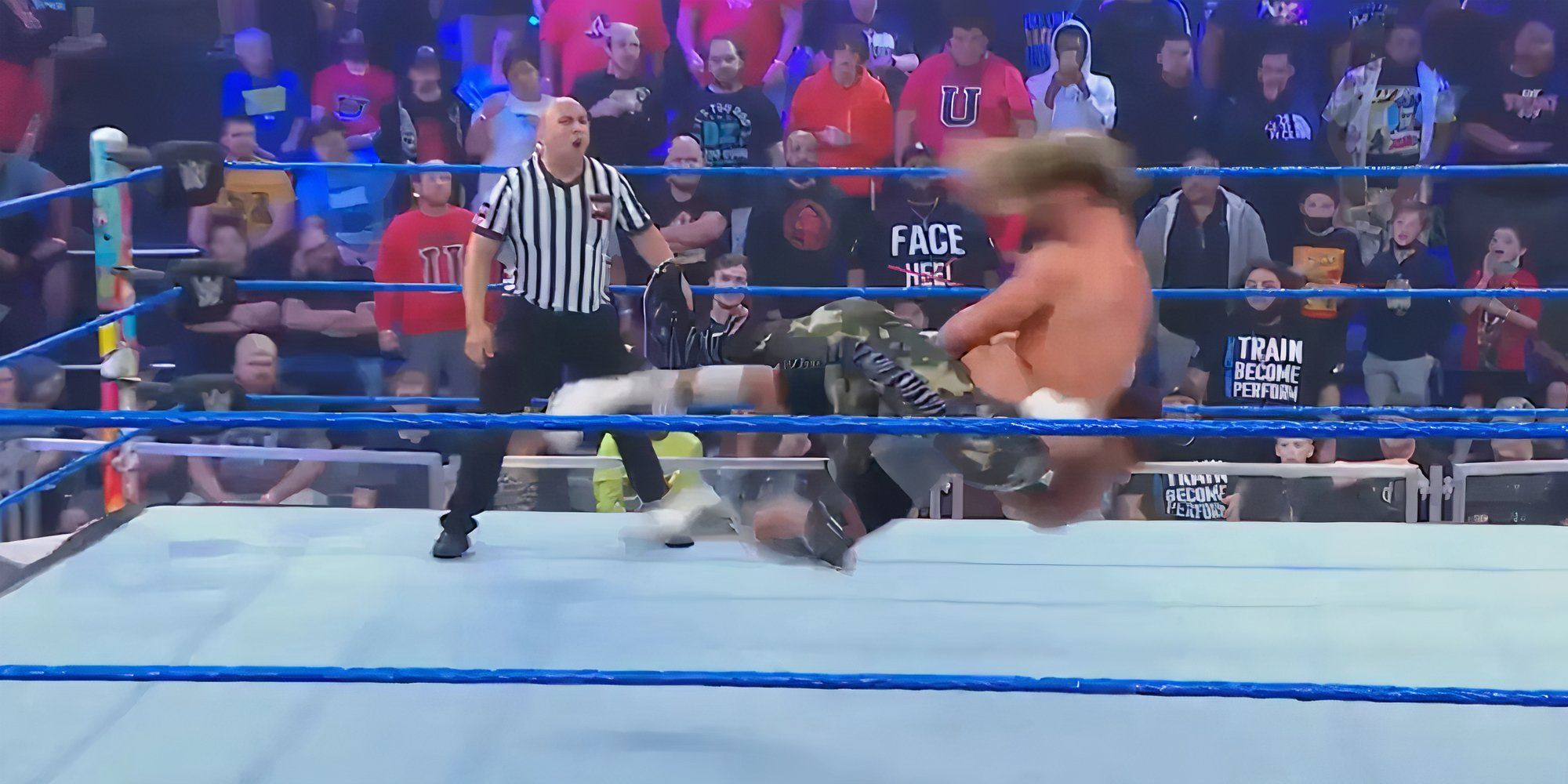 Bron Breakker hitting a spear on Dolph Ziggler.