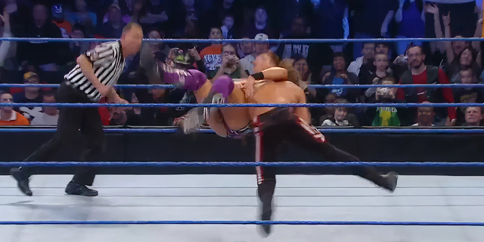 Edge hits a spear on The Miz.