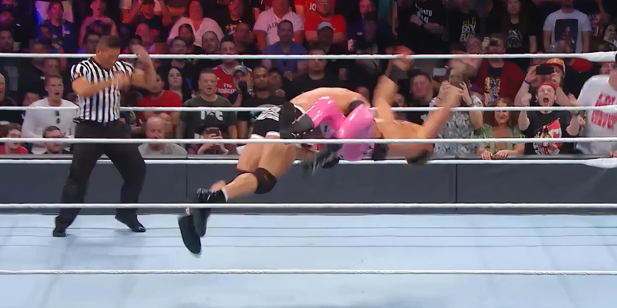 Goldberg hits a spear on Dolph Ziggler.
