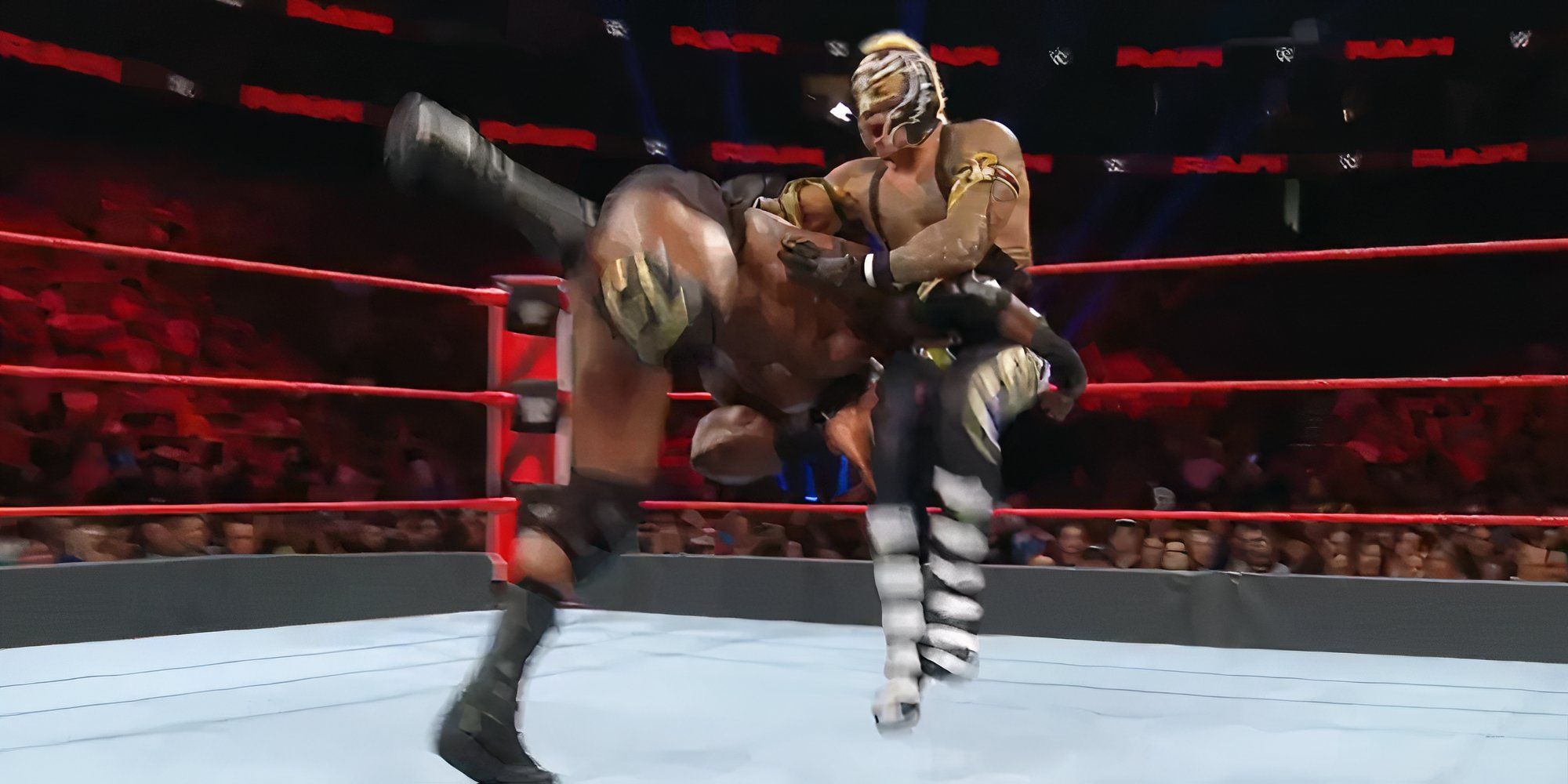 Bobby Lashley hits a spear on Rey Mysterio.