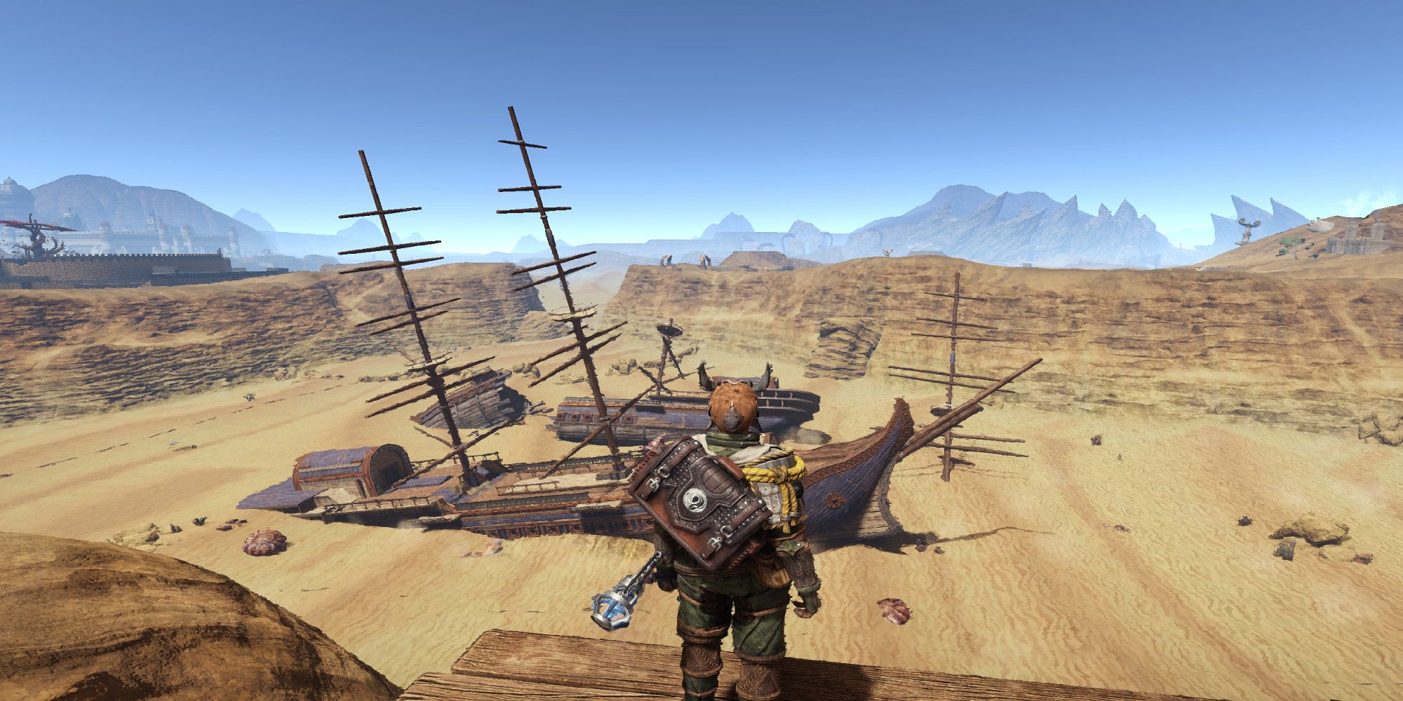 Outward player examining a beached ship in the desert